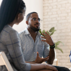 African American man speak at group therapy session 
