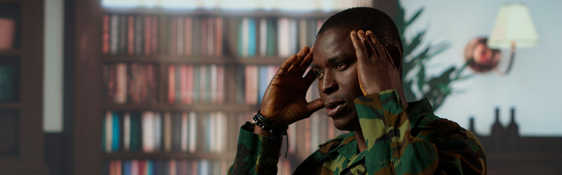 African american soldier remembering war flashbacks and dealing with a serious case of shell shock syndrome, traumatic memories. Armed forces veteran feels guilty with PTSD. Camera B.